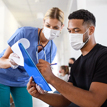 A volunteer works through a checklist for a clinical trial