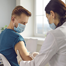 A doctor administers an investigational drug for a clinical trial